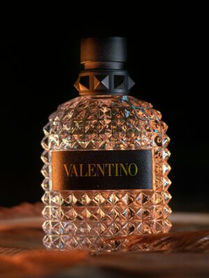 Elegant close-up of Valentino perfume bottle showcasing luxury and premium design.